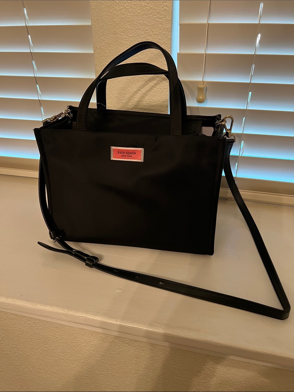 kate spade Black Nylon Crossbody with Pink Logo Plaque